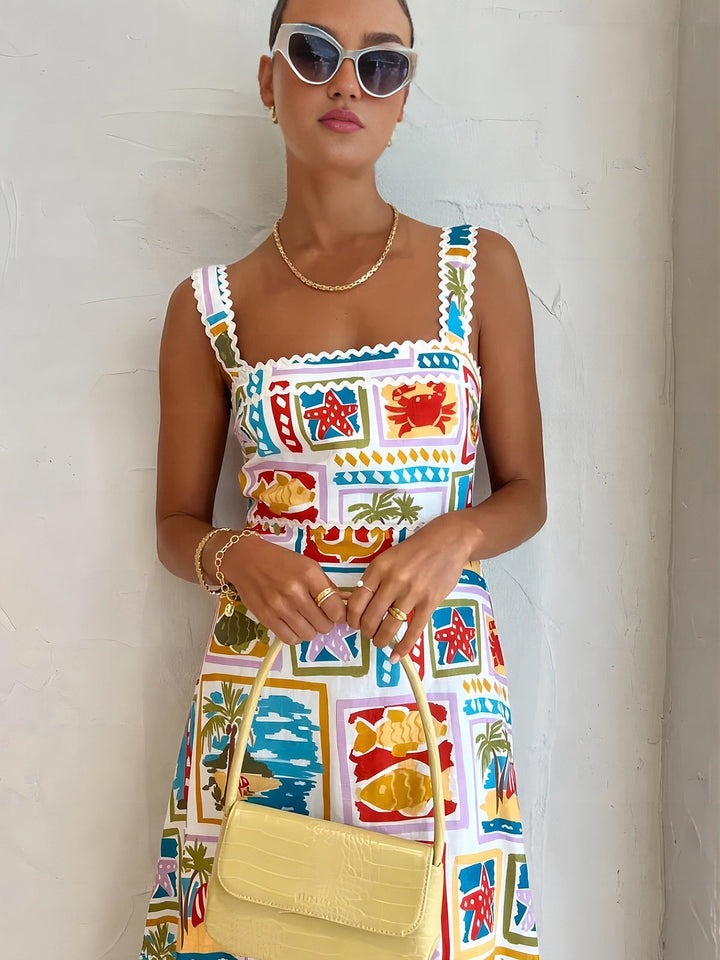 Sleeveless maxi dress with graffiti print – summer fashion with artistic flair
