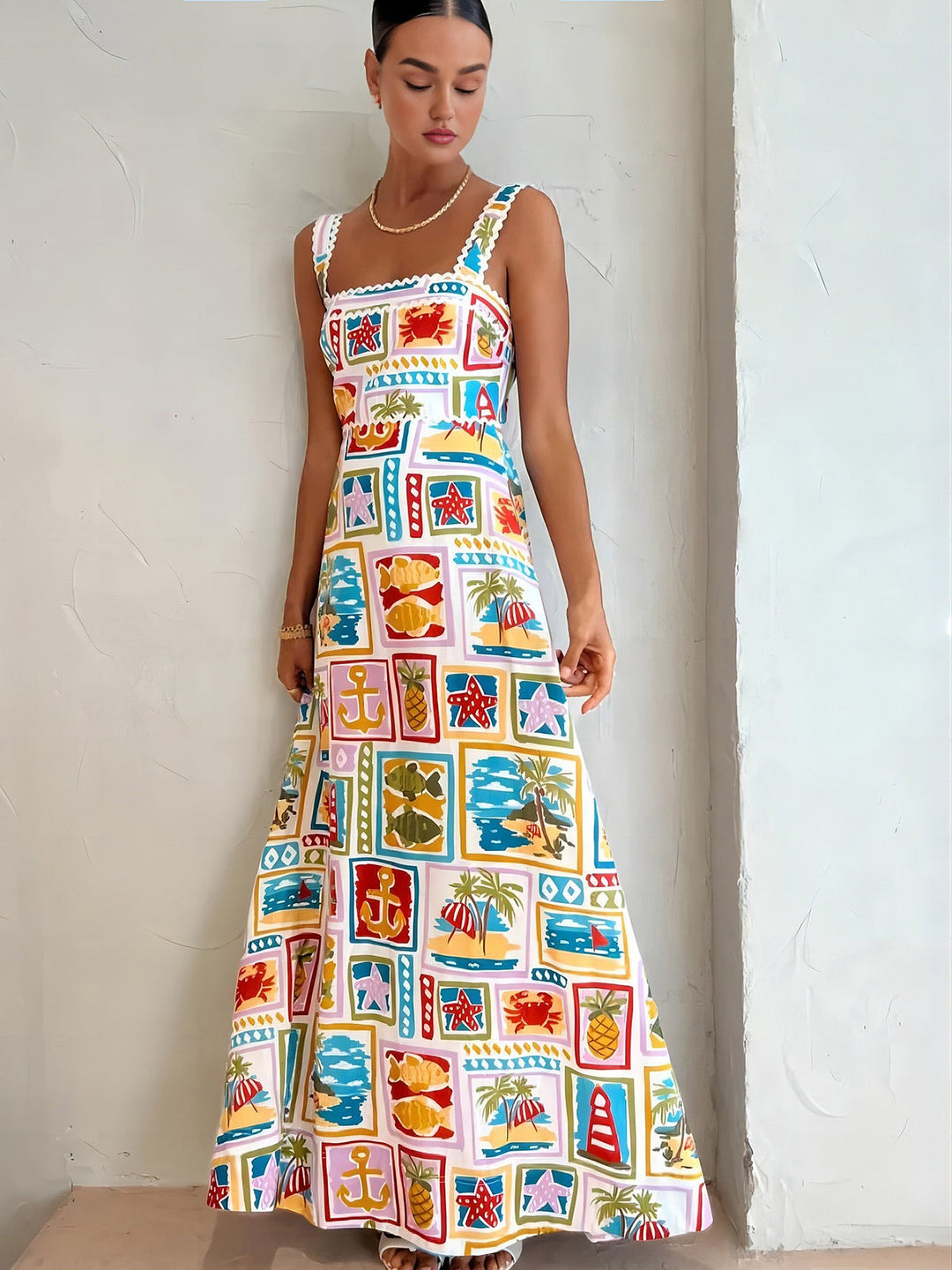 Sleeveless maxi dress with graffiti print – summer fashion with artistic flair