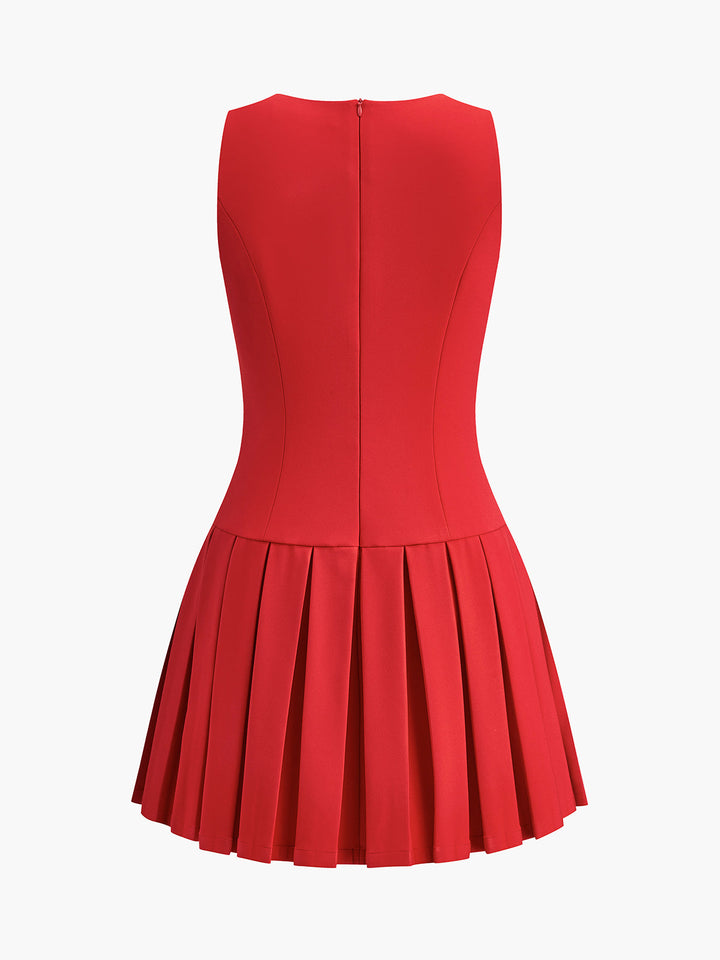 Elegant Sleeveless Mini Dress with Pleats and Metal Buttons