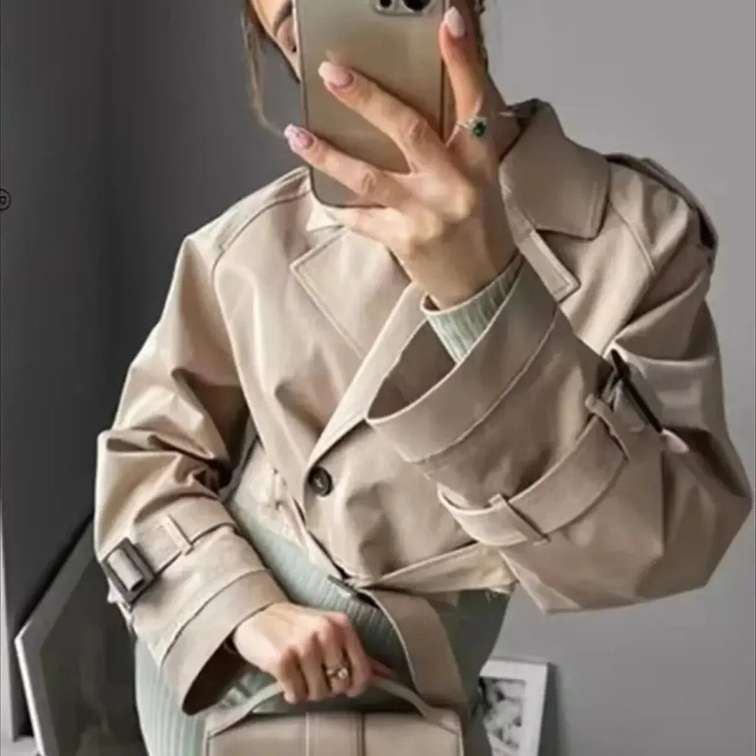 Women's short lightweight tailored trench coat with lapel collar and belt