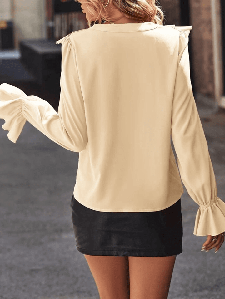 Women's blouse with ruffles V-neck and flared sleeves