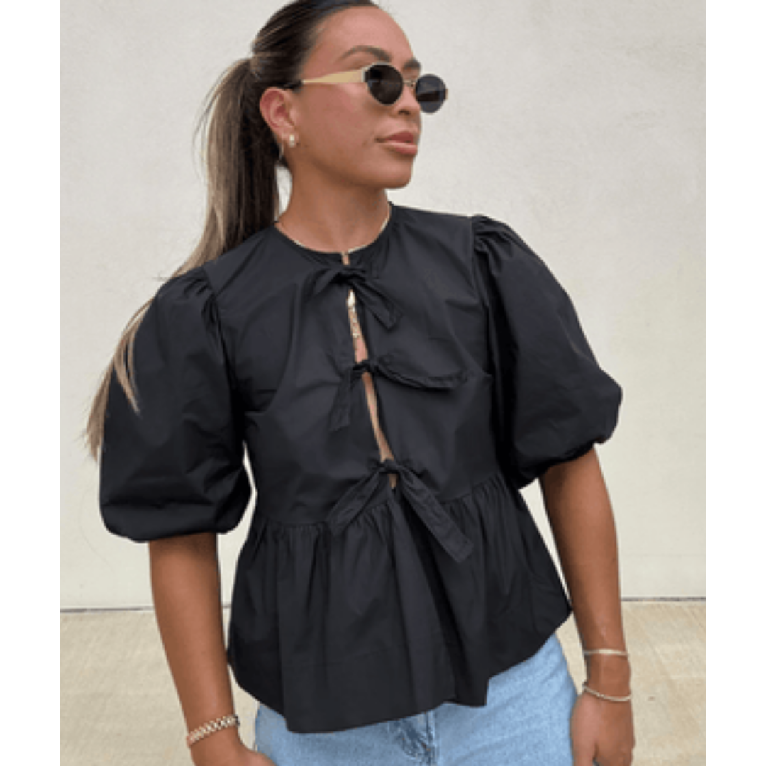 Women's blouse with puff sleeves and peplum cut