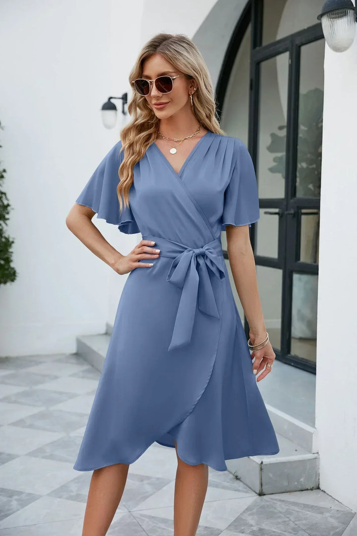 Elegant wrap dress with waist bow – midi length, V-neckline