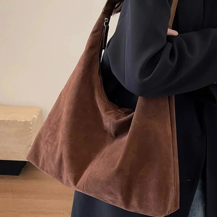 Women's handbag made of vegan suede with zipper