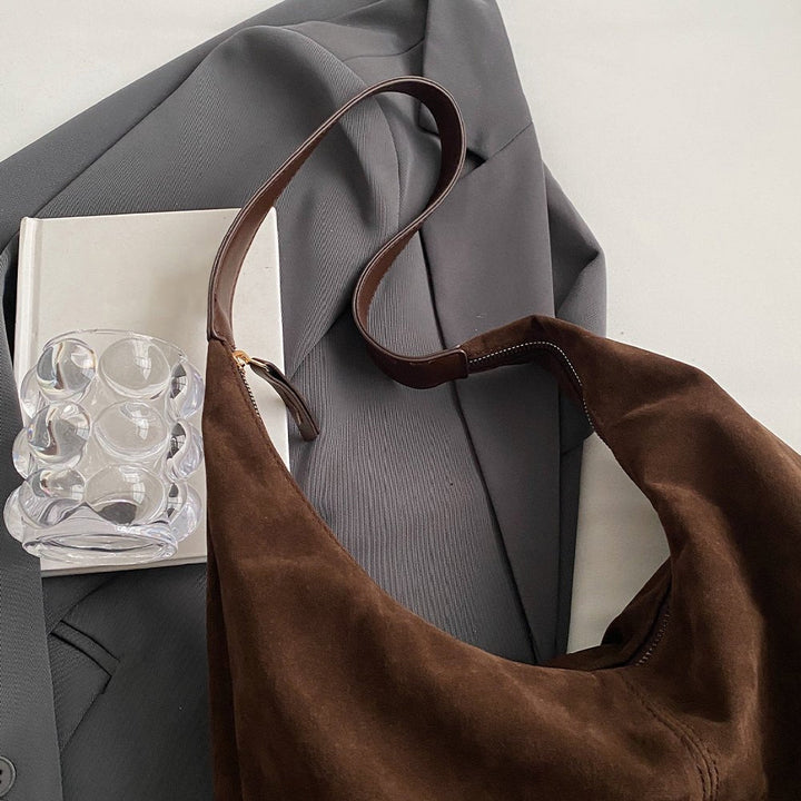 Women's handbag made of vegan suede with zipper