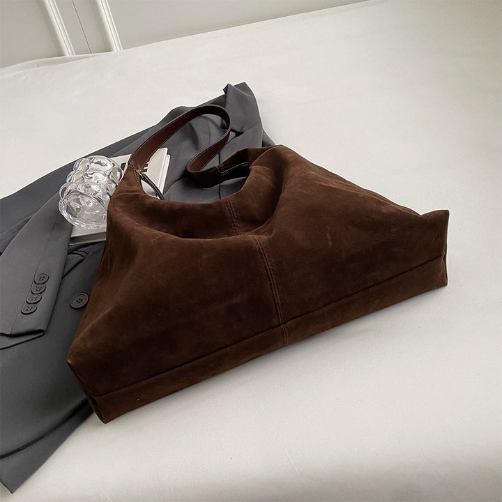 Women's handbag made of vegan suede with zipper