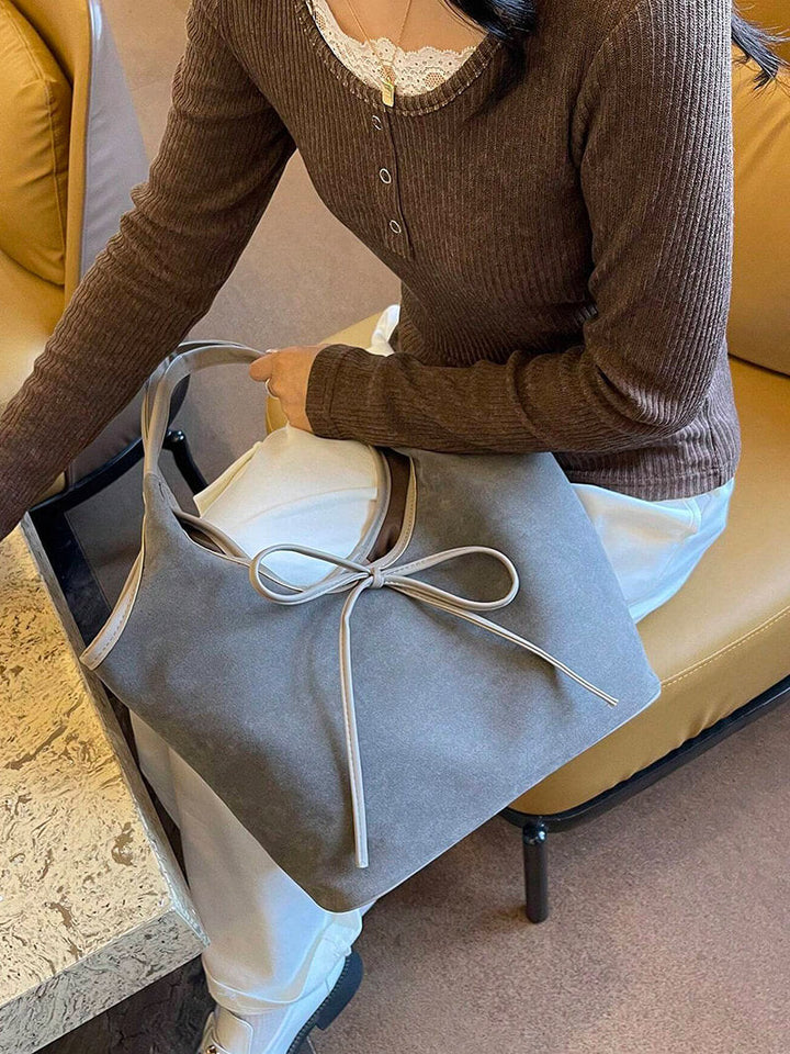 Vegan suede shoulder bag with bow – Elegant & sustainable