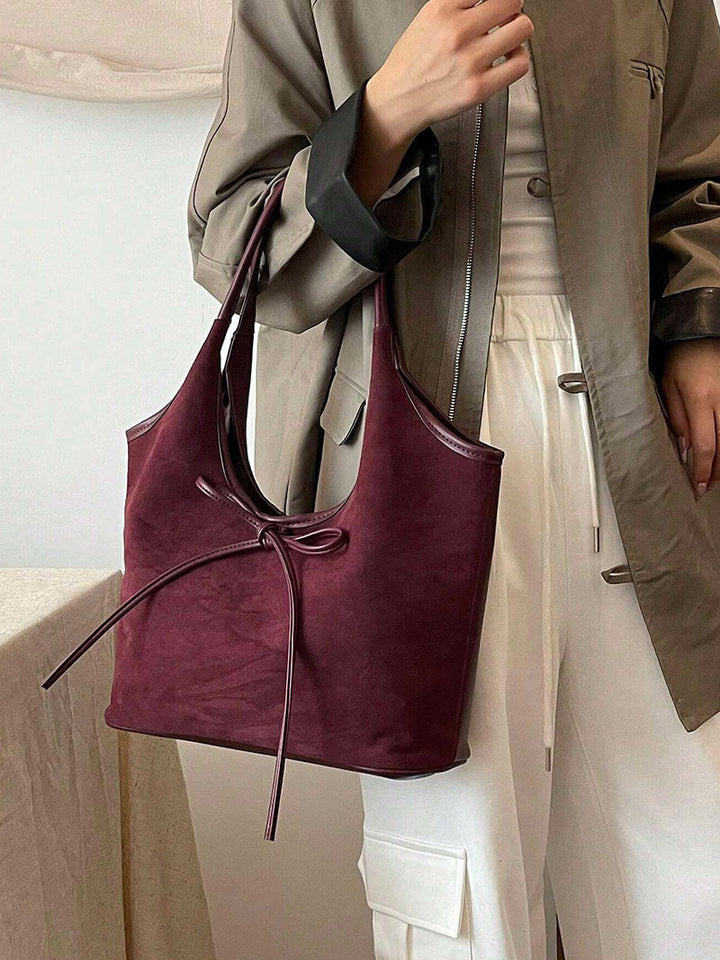 Vegan suede shoulder bag with bow – Elegant & sustainable