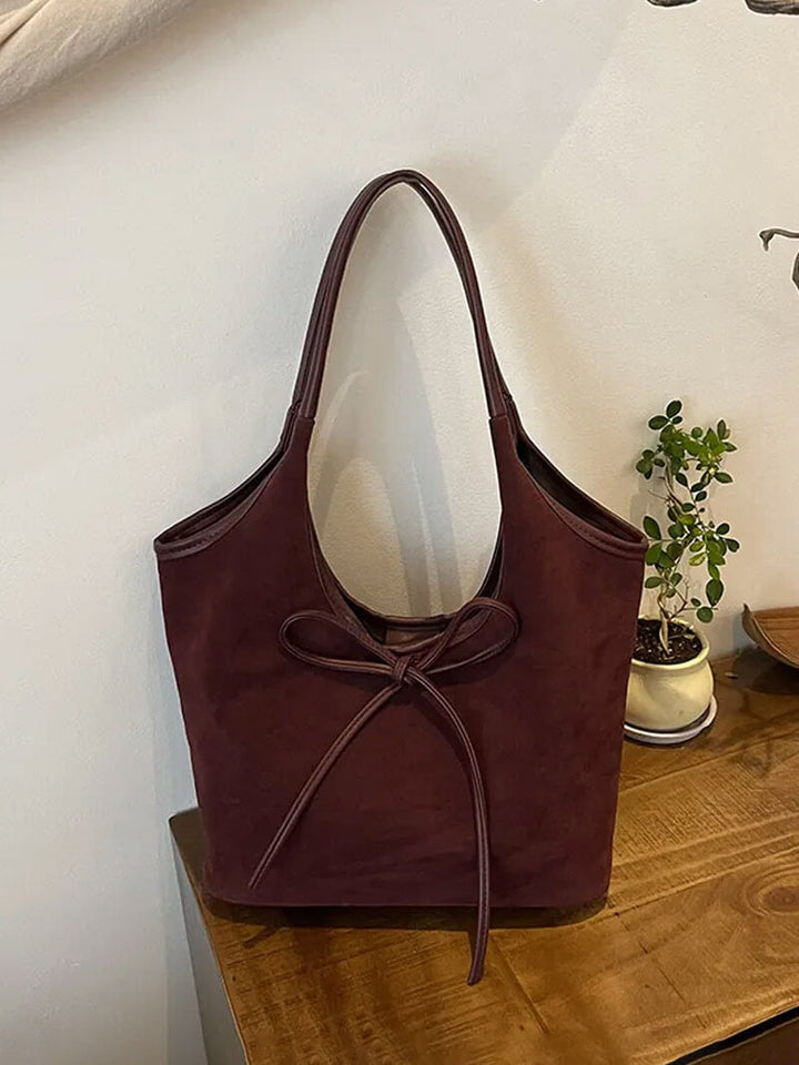 Vegan suede shoulder bag with bow – Elegant & sustainable
