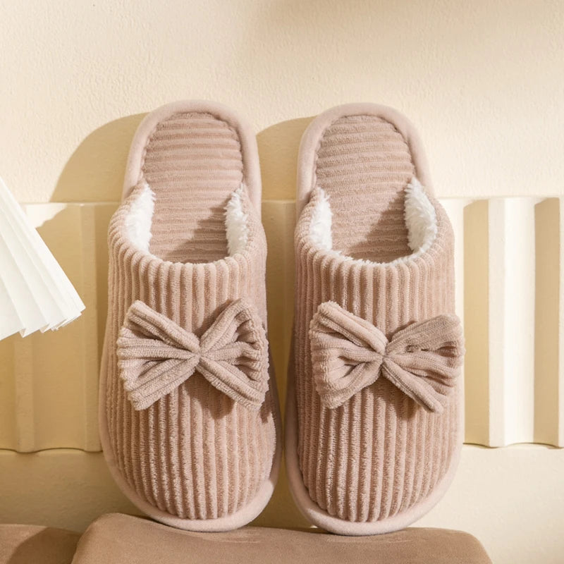 Warm women's closed slippers with bow detail for comfort and style