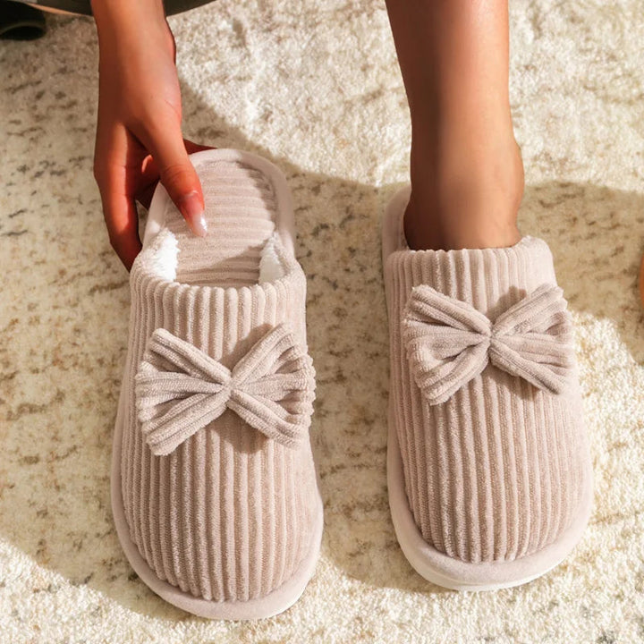 Warm women's closed slippers with bow detail for comfort and style