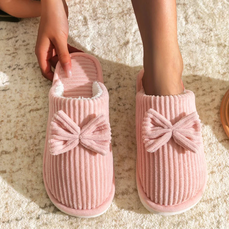 Warm women's closed slippers with bow detail for comfort and style
