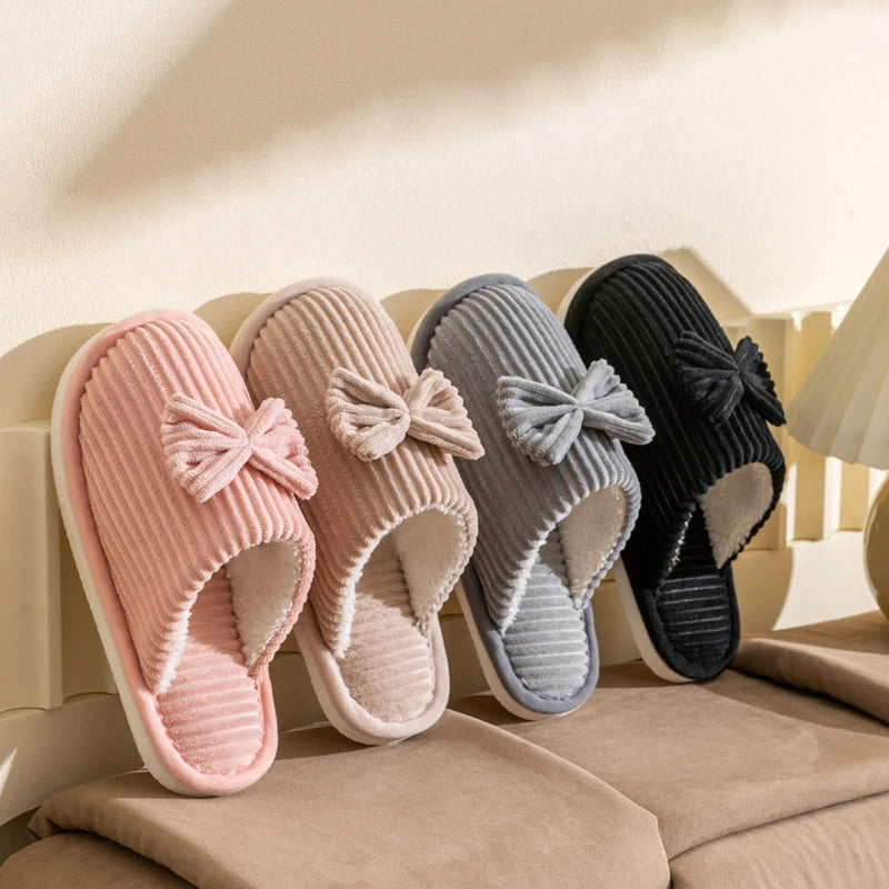 Warm women's closed slippers with bow detail for comfort and style