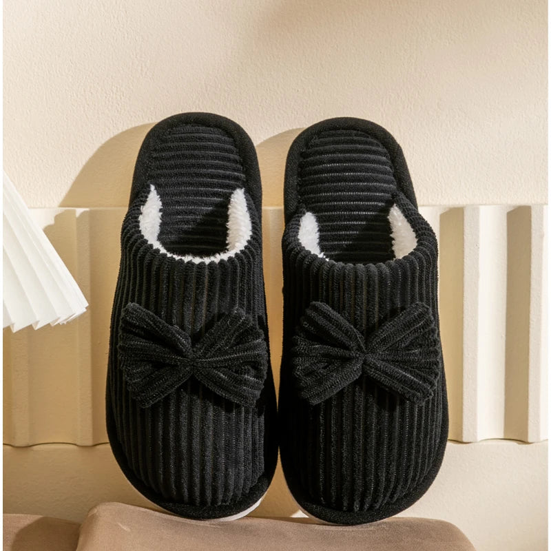 Warm women's closed slippers with bow detail for comfort and style