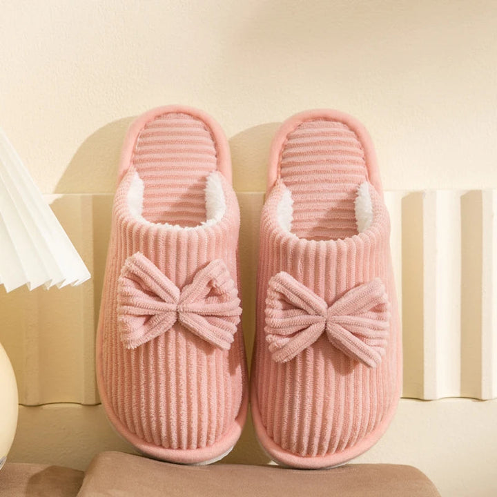 Warm women's closed slippers with bow detail for comfort and style