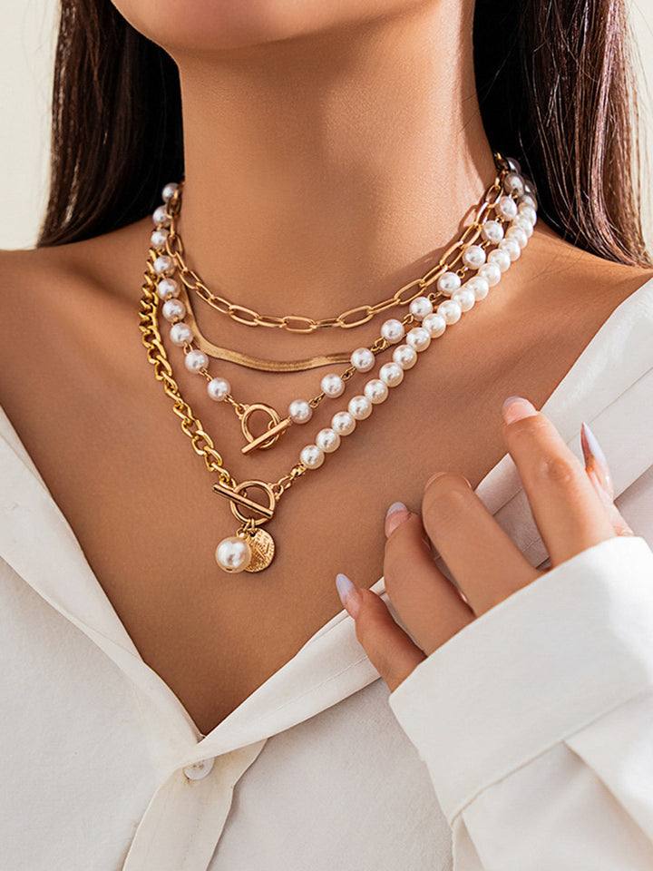 Elegant pearl necklace with gold chain – multi-strand design