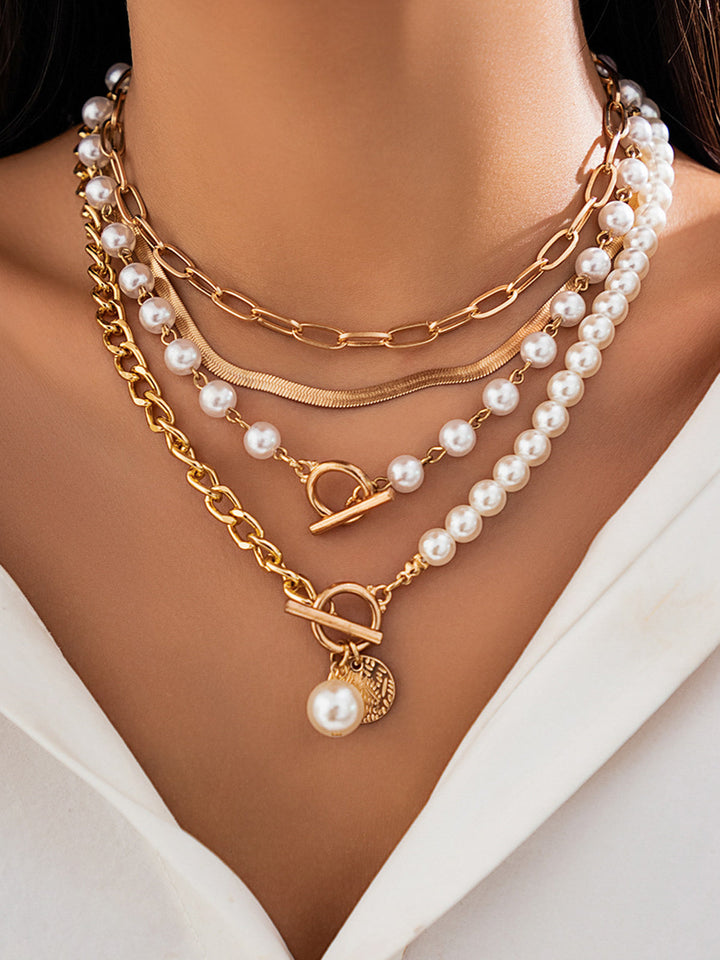 Elegant pearl necklace with gold chain – multi-strand design