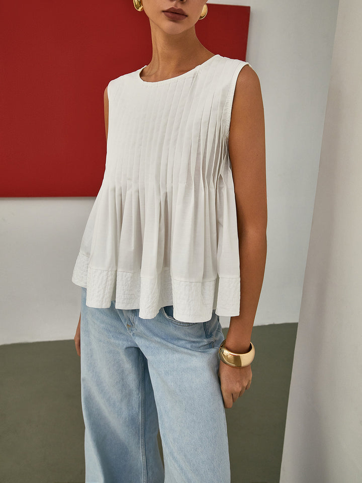 Sleeveless Pleated Peplum Blouse – Elegant Waist-Emphasized Look