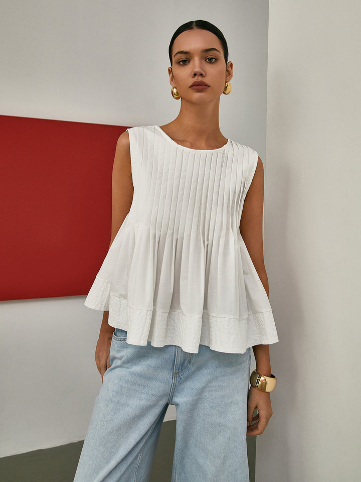 Sleeveless Pleated Peplum Blouse – Elegant Waist-Emphasized Look