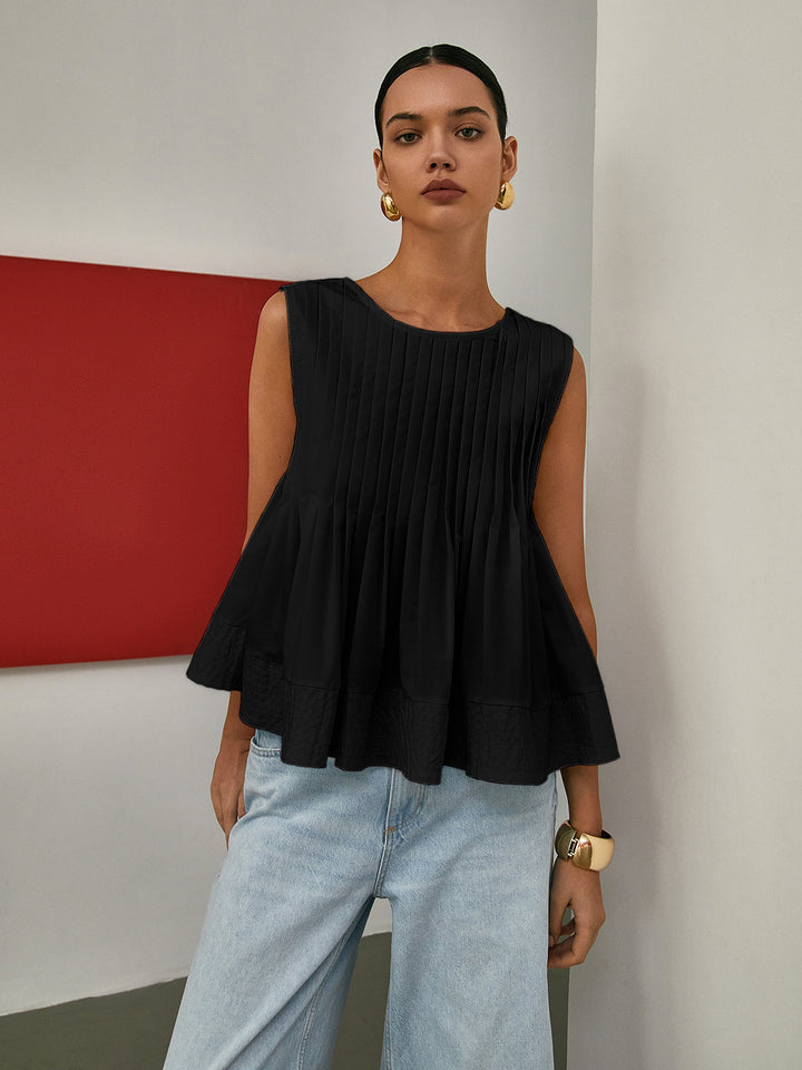 Sleeveless Pleated Peplum Blouse – Elegant Waist-Emphasized Look