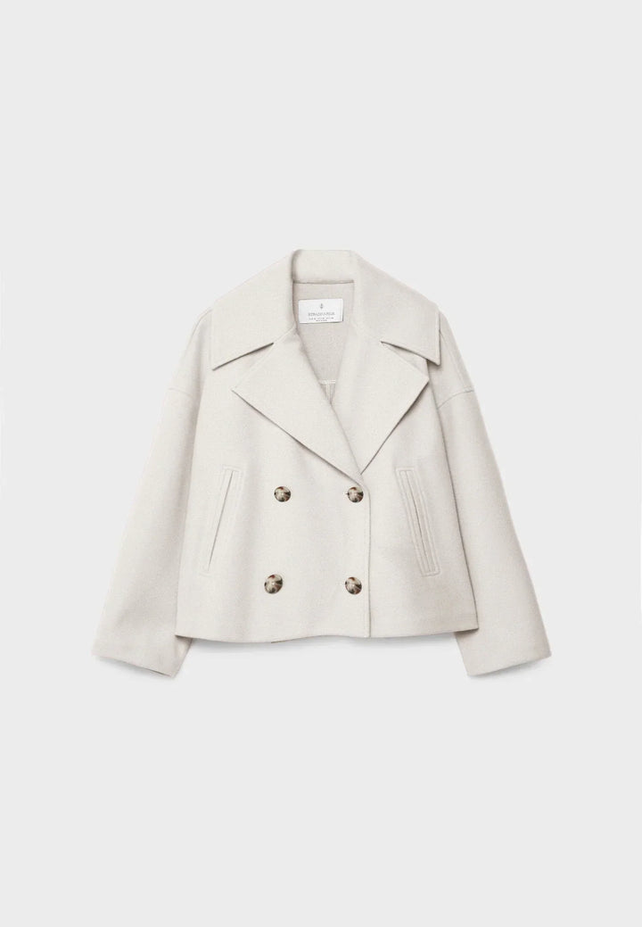 Short women's coat with double row of buttons made of vegan leather