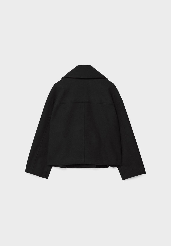Short women's coat with double row of buttons made of vegan leather