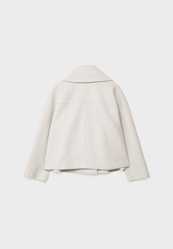 Short women's coat with double row of buttons made of vegan leather