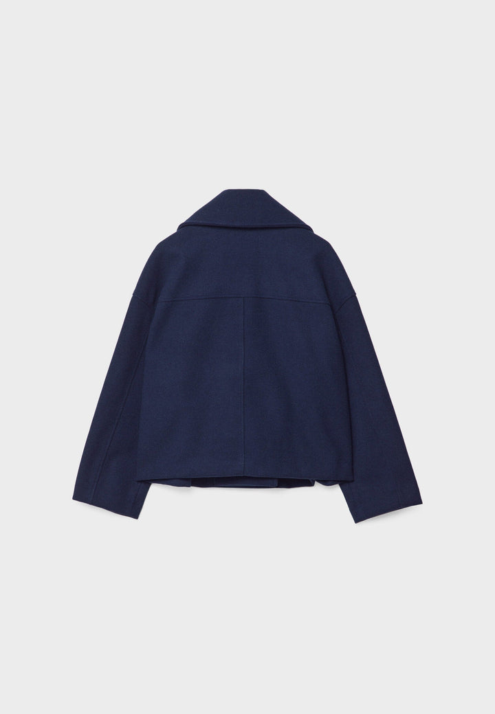 Short women's coat with double row of buttons made of vegan leather