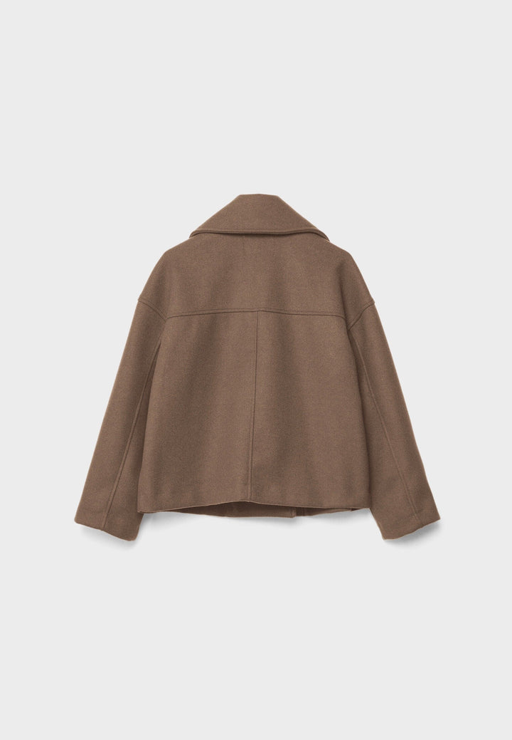 Short women's coat with double row of buttons made of vegan leather