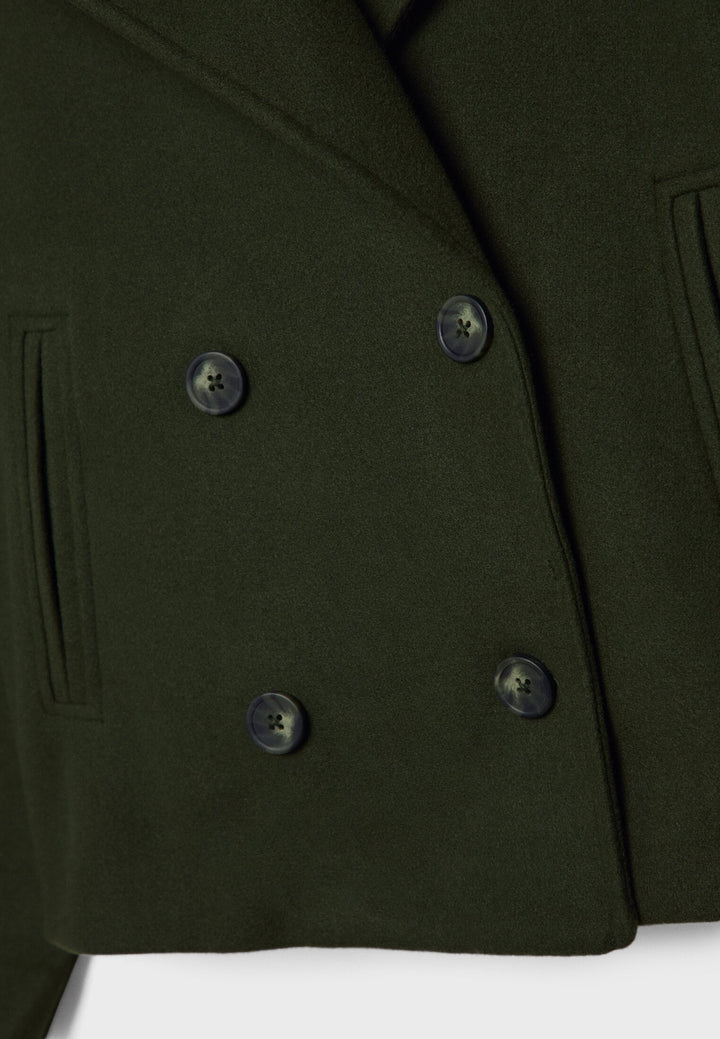 Short women's coat with double row of buttons made of vegan leather