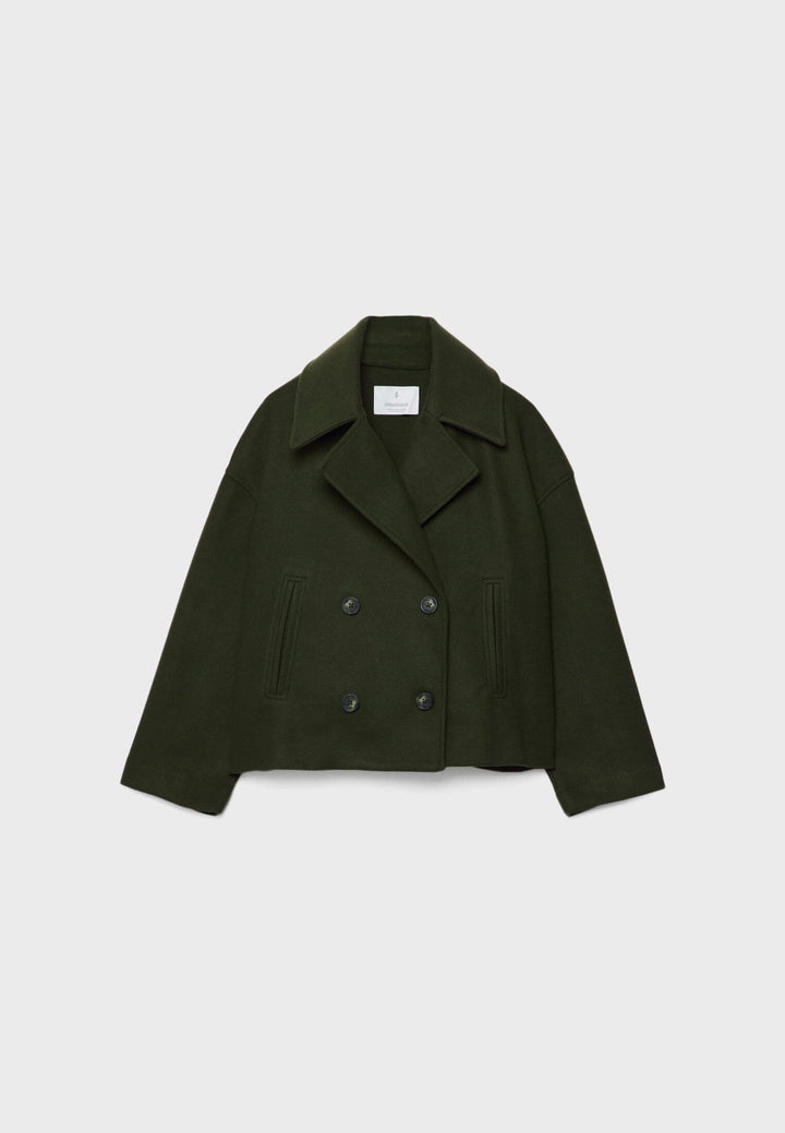 Short women's coat with double row of buttons made of vegan leather
