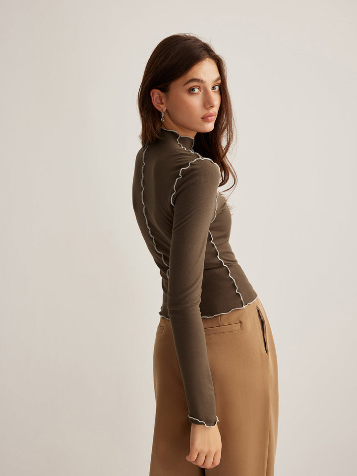 Haut pour femmes en jersey avec col montant et passepoil contrasté design élégant