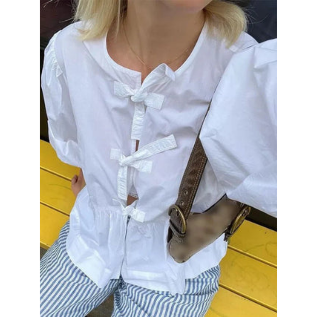 Women's blouse with puff sleeves and peplum cut