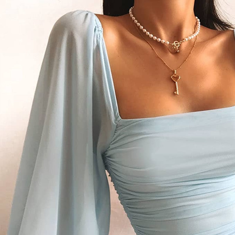 Elegant bodycon mini dress with balloon sleeves – stretch evening dress